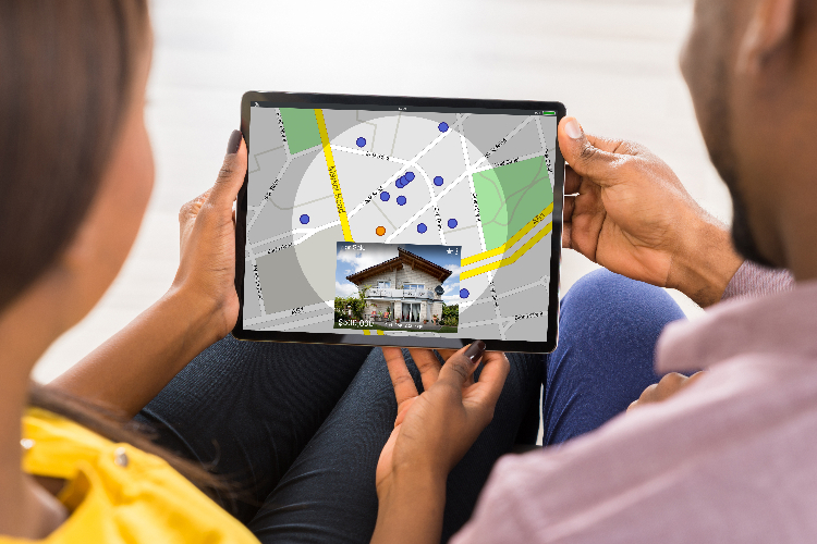 couple with tablet with real estate map