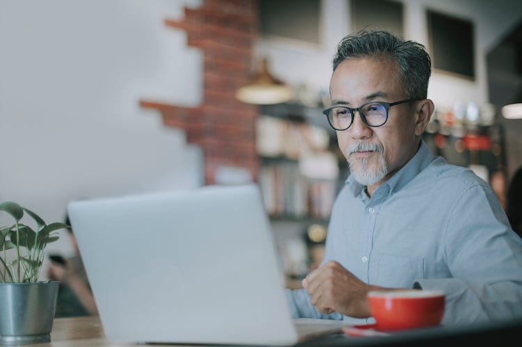 man looking at computer