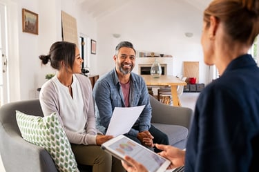 real estate agent discussing home sale with sellers