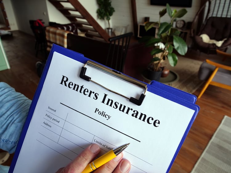 renters insurance policy on clipboard
