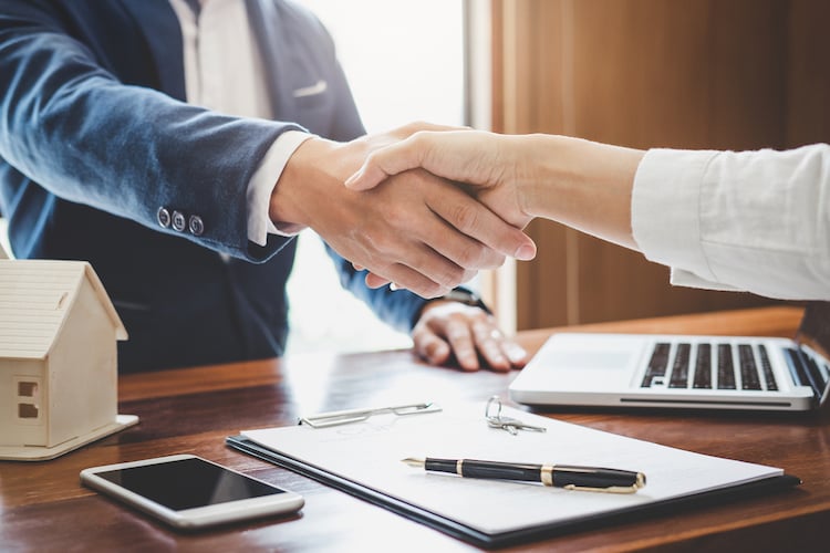 seller and agent shaking hands