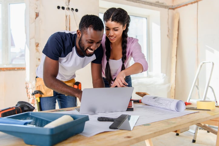 smiling couple with home renovation