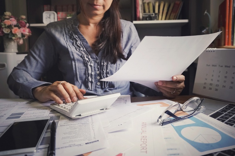 woman calculating taxes