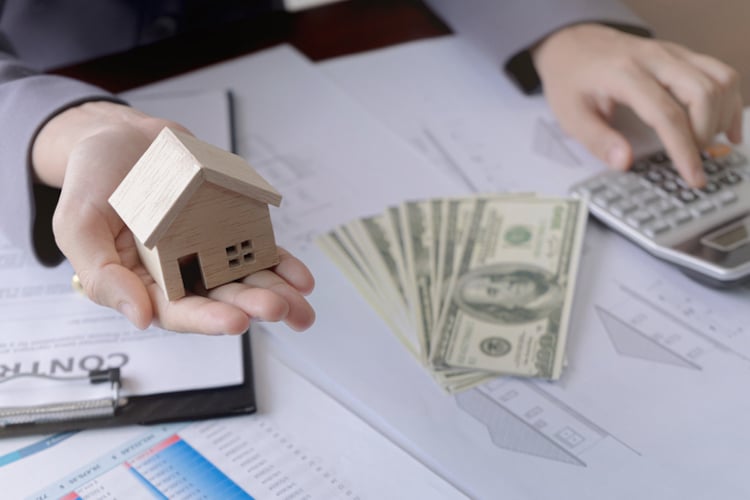 wooden house with cash